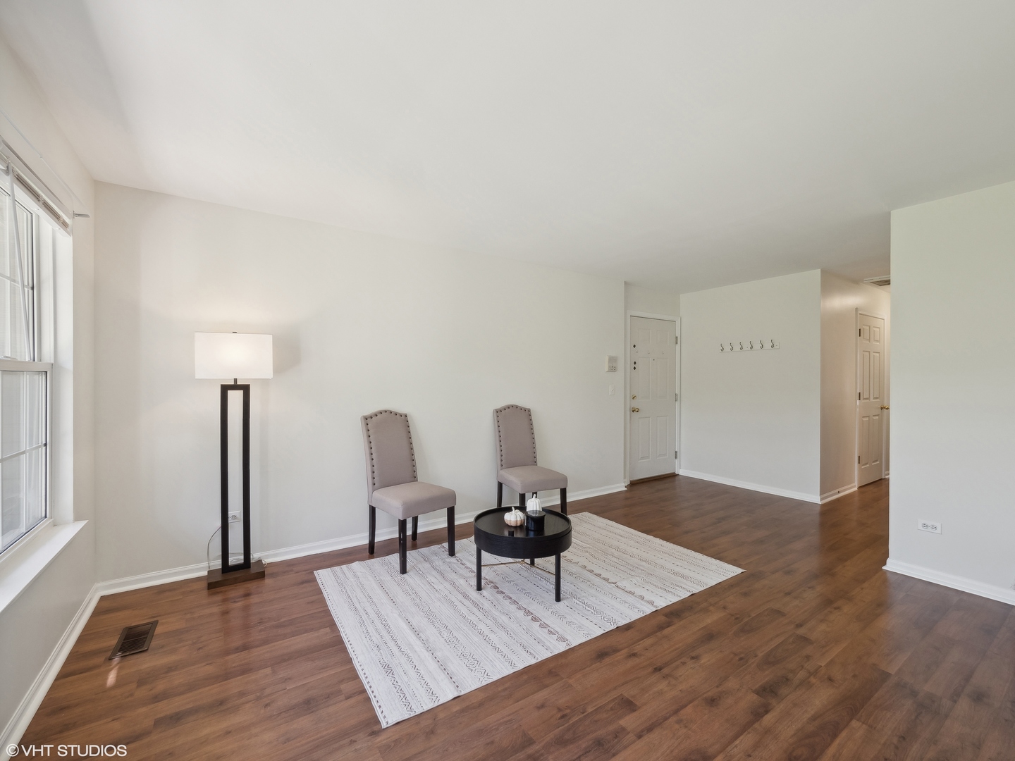 305 Buckingham Circle, Unit B Elgin, IL 60120 - Photo 12 of 20 a view of a workspace with furniture and wooden floor