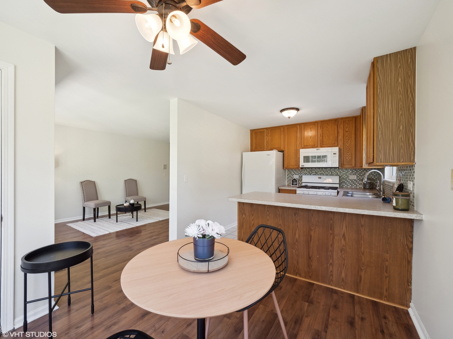 305 Buckingham Circle, Unit B Elgin, IL 60120 - Photo 15 of 20 a kitchen with a sink cabinets and window