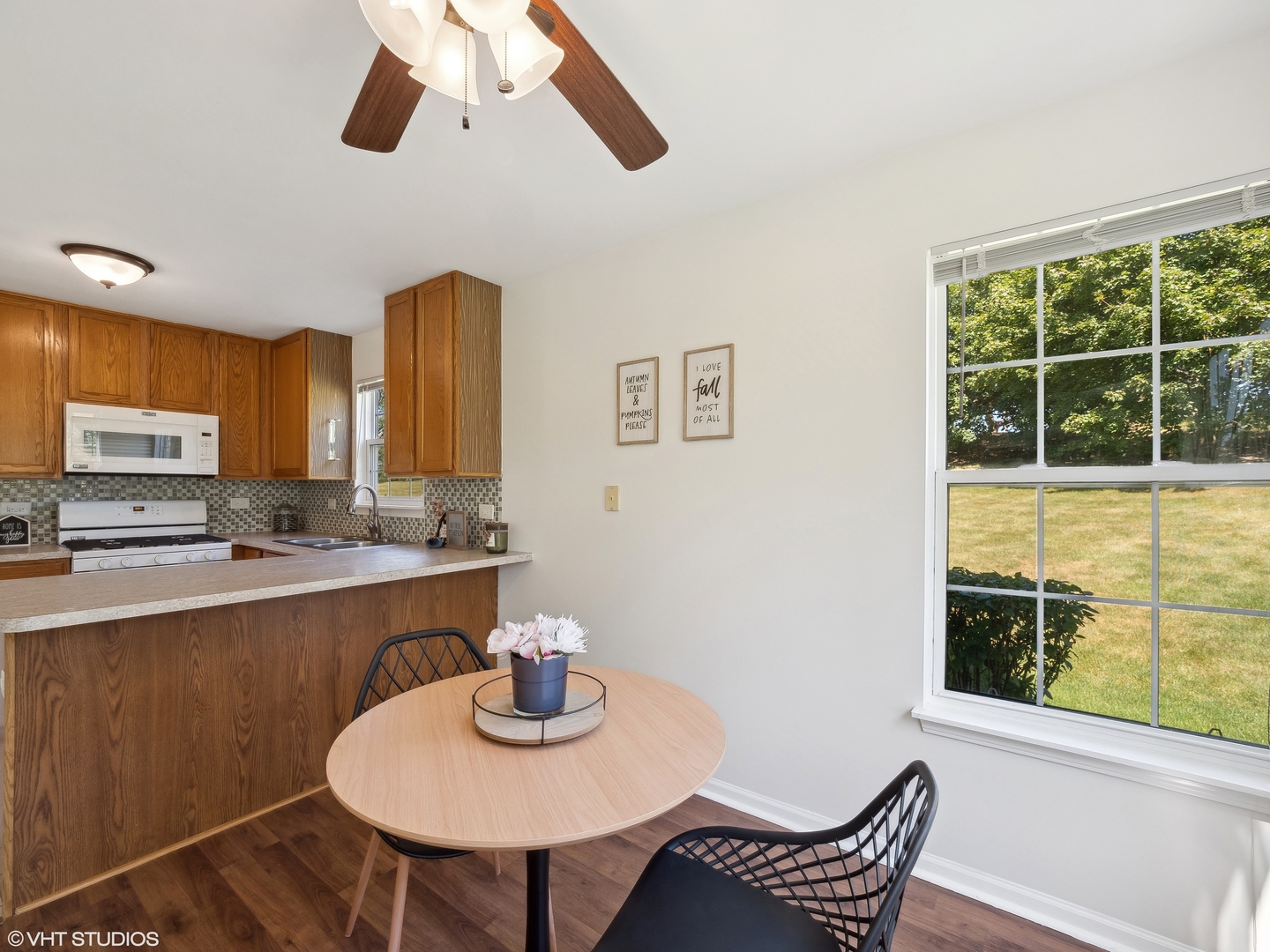305 Buckingham Circle, Unit B Elgin, IL 60120 - Photo 16 of 20 a view of a dining room with furniture window and outside view