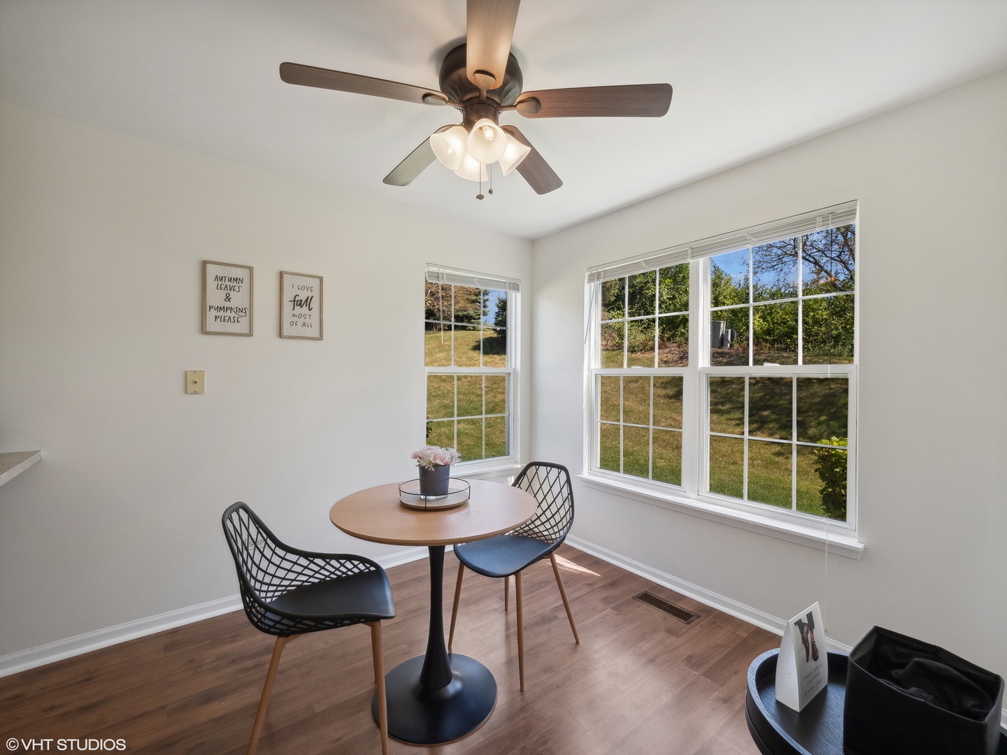 305 Buckingham Circle, Unit B Elgin, IL 60120 - Photo 17 of 20 a view of a dining room with furniture window and wooden floor