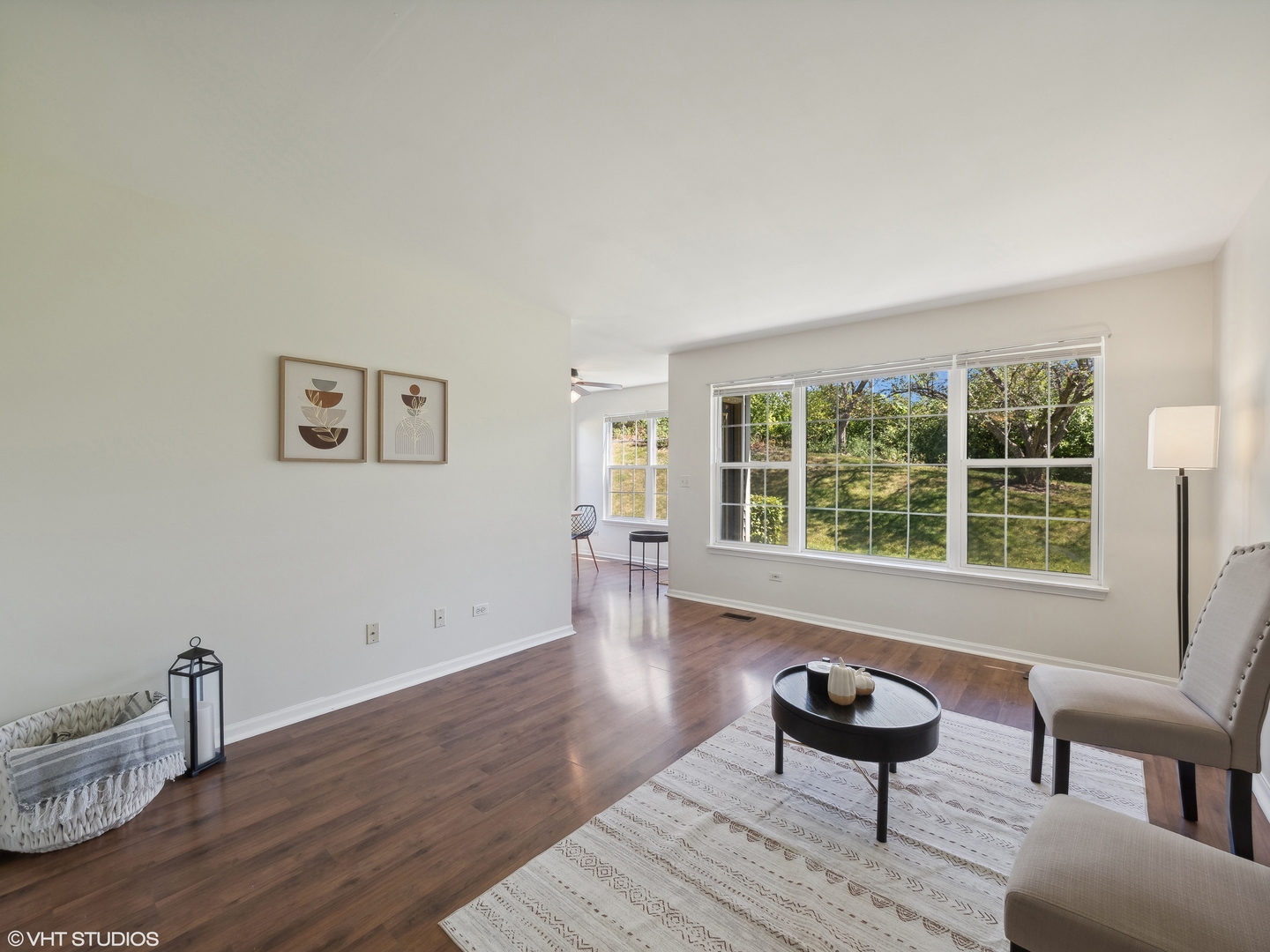 305 Buckingham Circle, Unit B Elgin, IL 60120 - Photo 3 of 20 a living room with furniture and a wooden floor