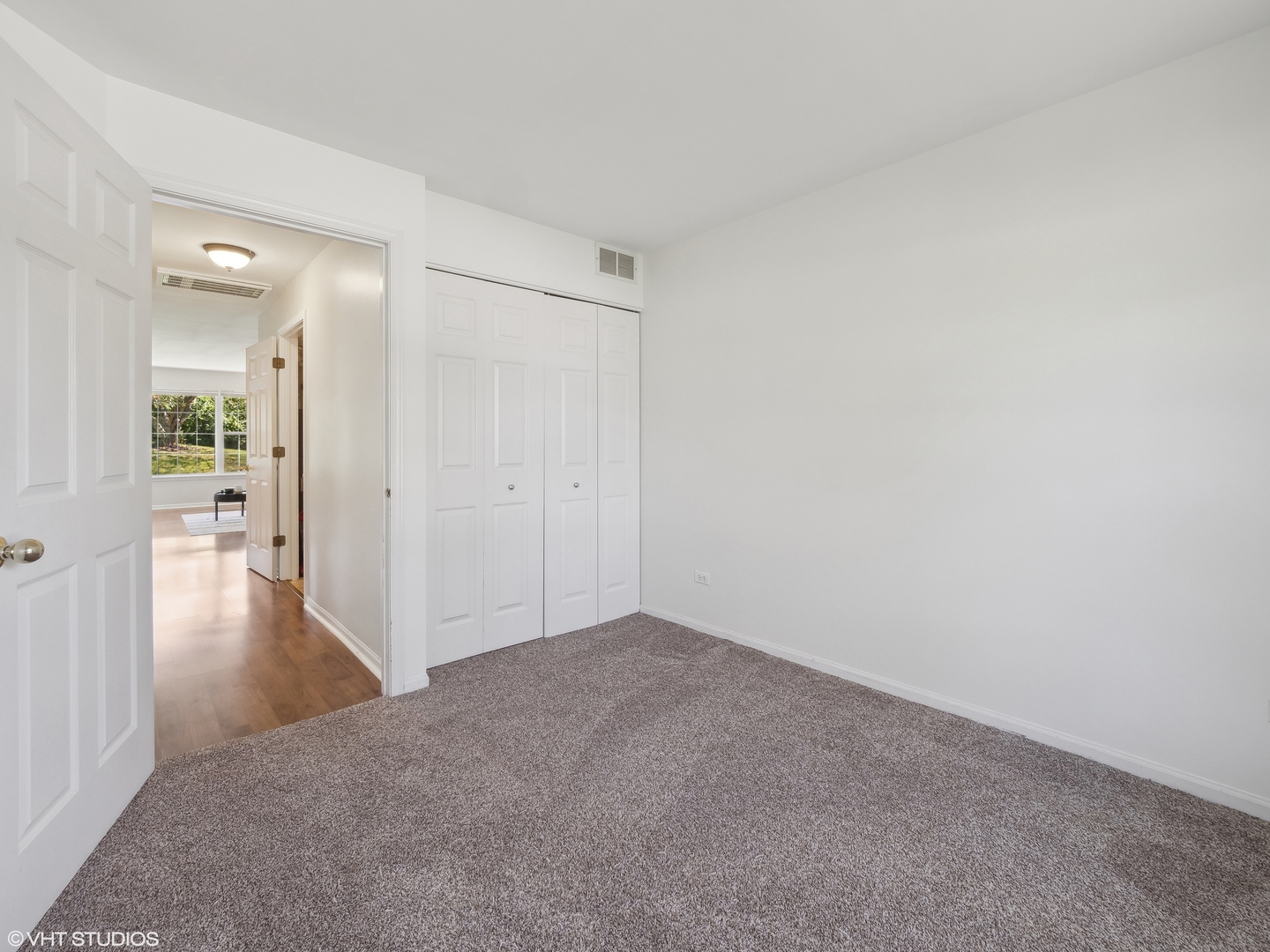 305 Buckingham Circle, Unit B Elgin, IL 60120 - Photo 8 of 20 a view of a hallway with wooden floor
