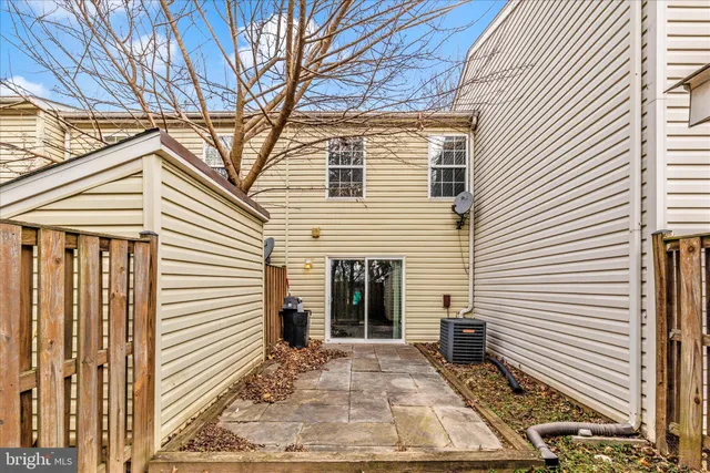 a view of a house with a yard and a garage