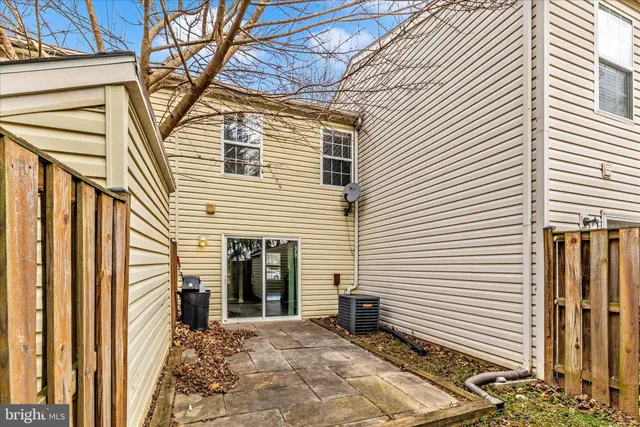 a view of a house with a yard and tree s