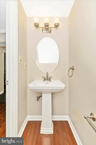 a bathroom with a sink and mirror