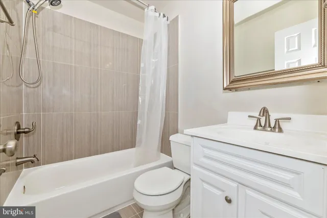 a bathroom with a sink a toilet and a bathtub