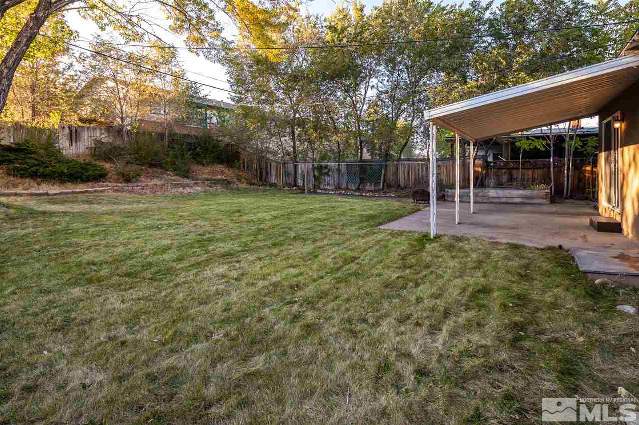495 Ballentyne Way Reno, NV 89502 - Photo 20 of 25 a view of a backyard with a garden