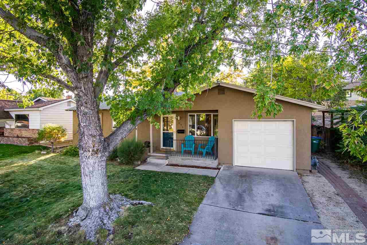 495 Ballentyne Way Reno, NV 89502 - Photo 3 of 25 a front view of a house with a garden and trees