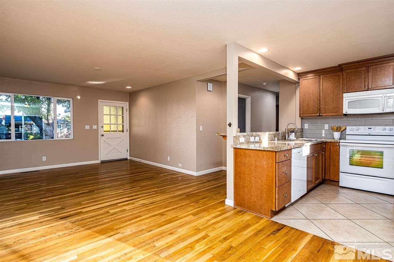 495 Ballentyne Way Reno, NV 89502 - Photo 8 of 25 a view of kitchen with granite countertop cabinets and a sink