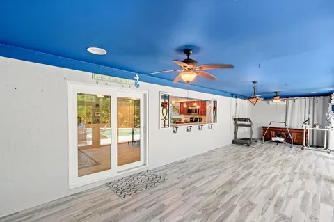 a view of a livingroom with furniture and a flat screen tv