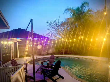 a view of swimming pool with outdoor seating