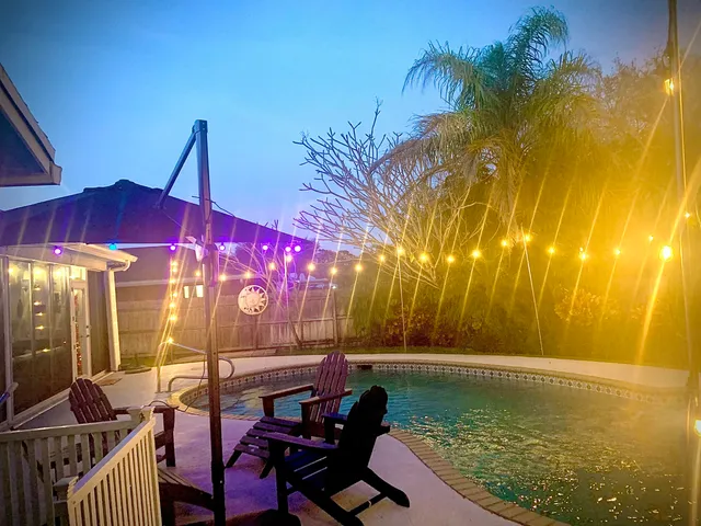 a view of swimming pool with outdoor seating