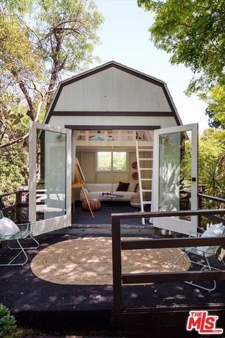 a view of house with backyard