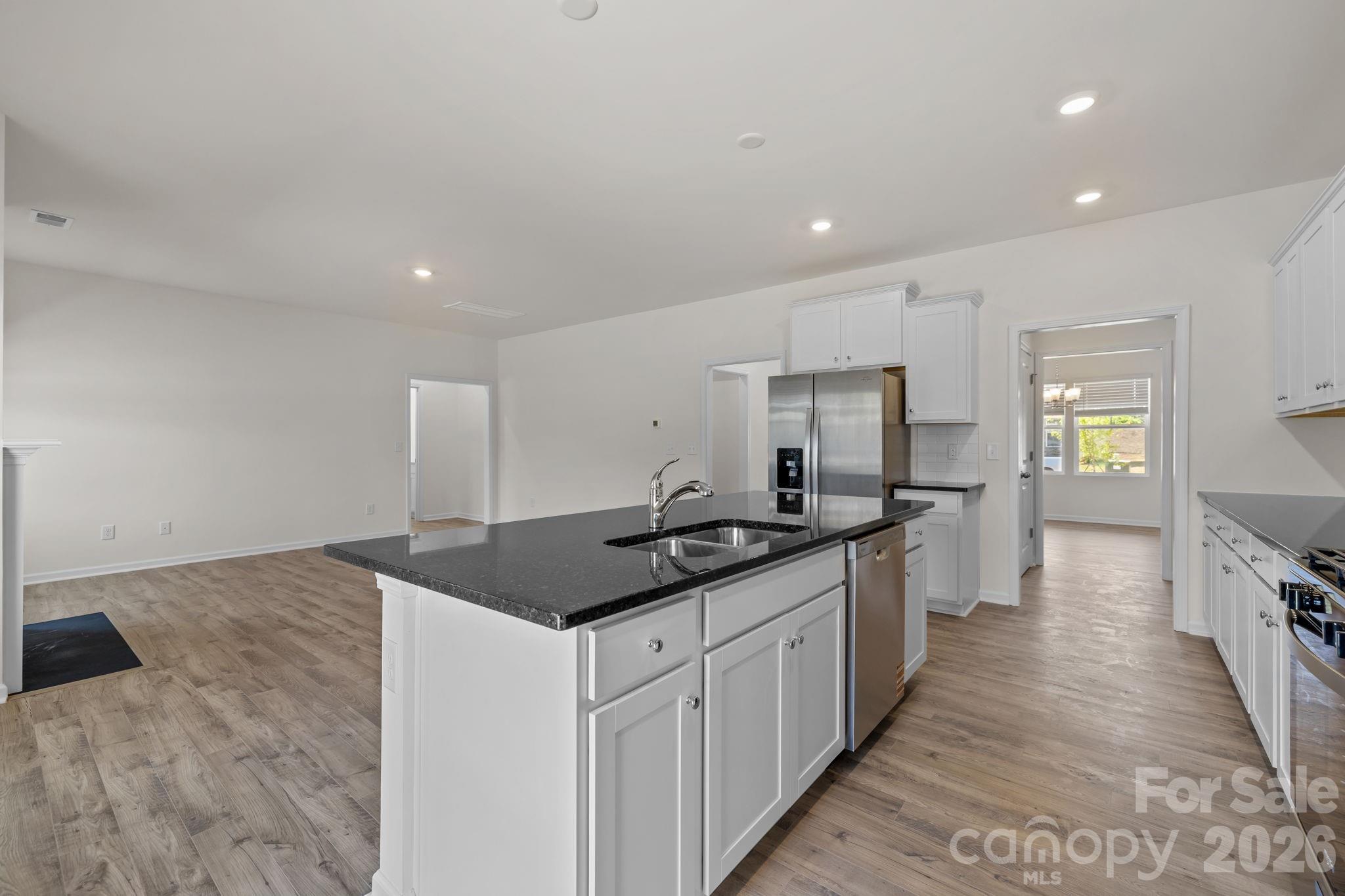 463 Brick House Road York, SC 29745 - Photo 11 of 35 a kitchen with stainless steel appliances granite countertop a sink and cabinets