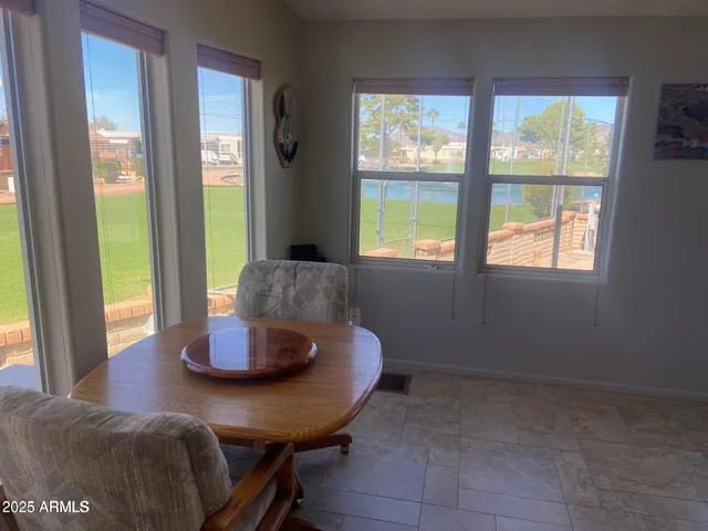 a kitchen with stainless steel appliances granite countertop a refrigerator a stove and a sink