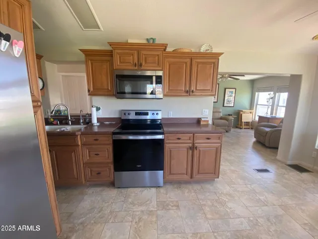 a view of a dining room with furniture and a window