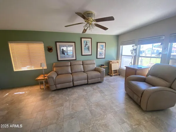 a living room with furniture and a window