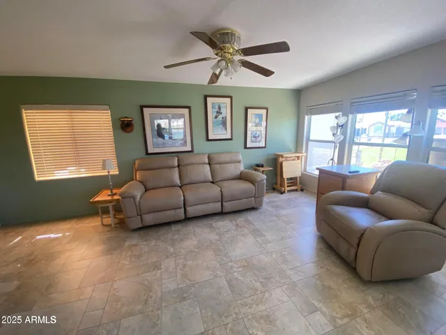 a living room with furniture and a window
