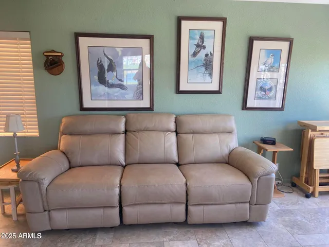 a living room with furniture and a couch