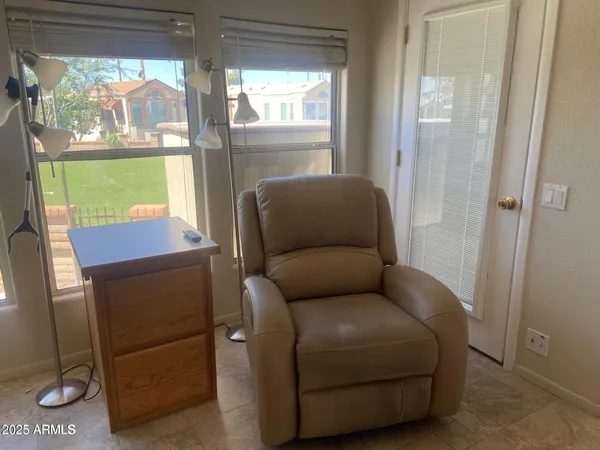 a living room with furniture and a window