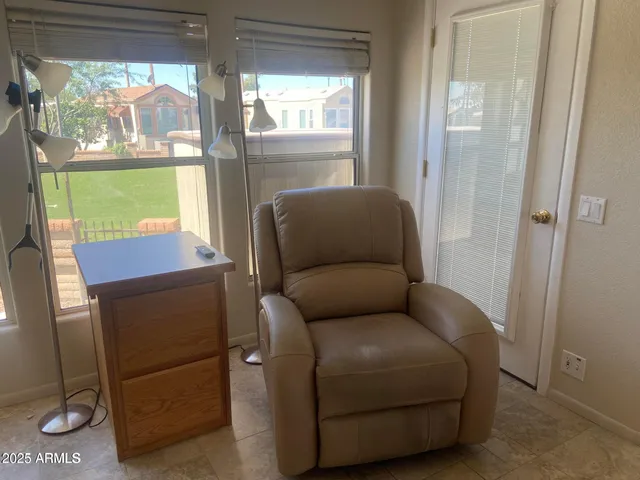 a living room with furniture and a window