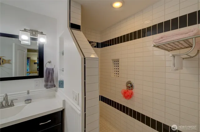 a bathroom with a sink and a mirror