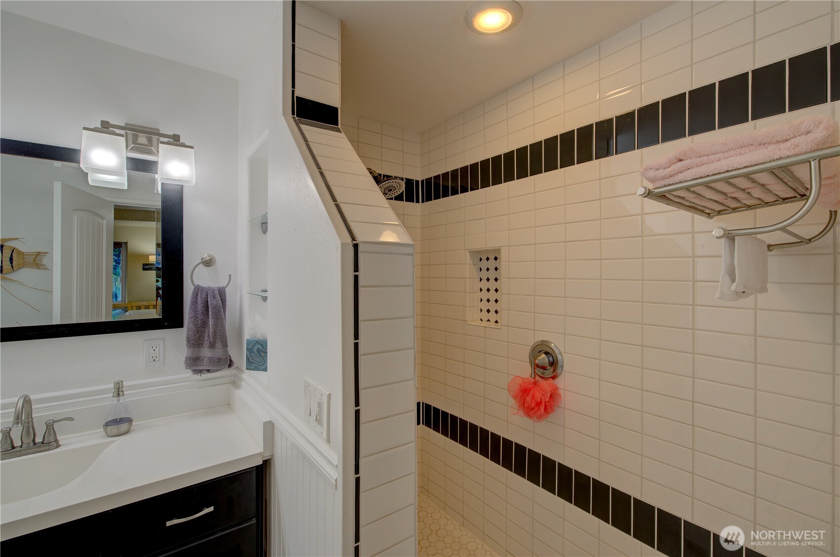 2144 Reservoir Road Ilwaco, WA 98624 - Photo 18 of 31 a bathroom with a sink and a mirror