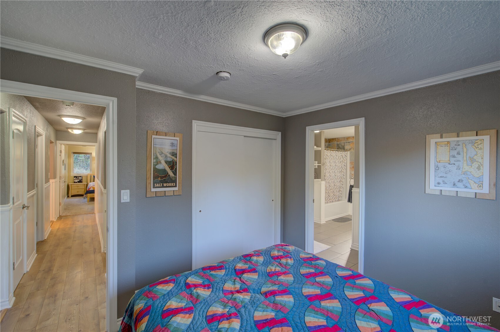 2144 Reservoir Road Ilwaco, WA 98624 - Photo 20 of 31 a bedroom with a bed and a view of bathroom