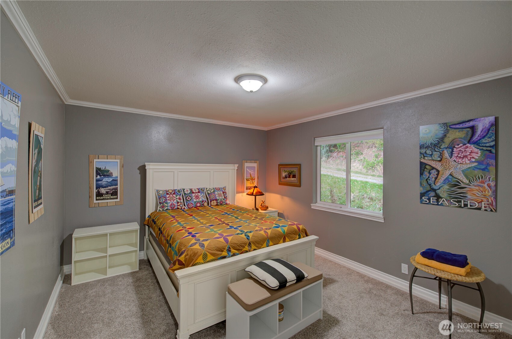 2144 Reservoir Road Ilwaco, WA 98624 - Photo 21 of 31 a room with a bed and a window