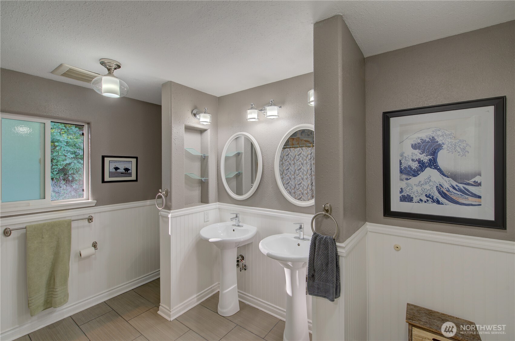 2144 Reservoir Road Ilwaco, WA 98624 - Photo 22 of 31 a bathroom with a toilet a sink and a mirror
