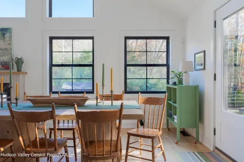 a spacious bedroom with a bed and a fireplace