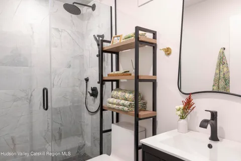 a bath tub sitting in a bathroom next to a window
