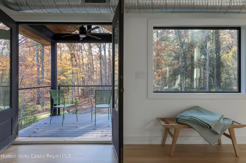 a kitchen with a sink and a mirror