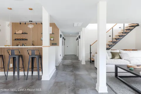 a view of a dining room with furniture and a table