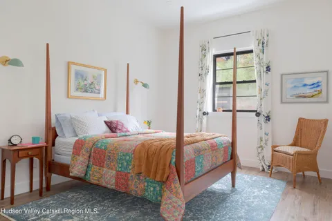 a front view of a house with a yard table and chairs
