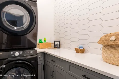 a view of a patio with table and chairs and wooden floor