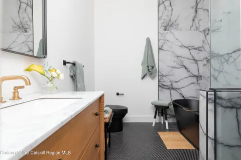 a view of a house with a snow on the road