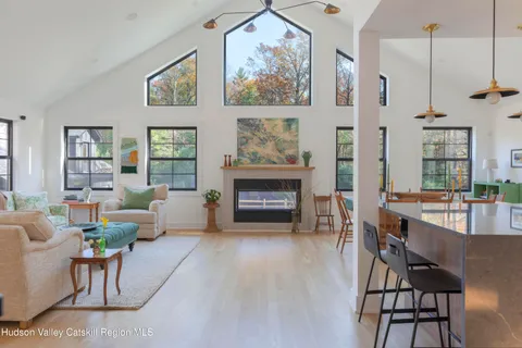 a view of balcony with furniture and wooden floor
