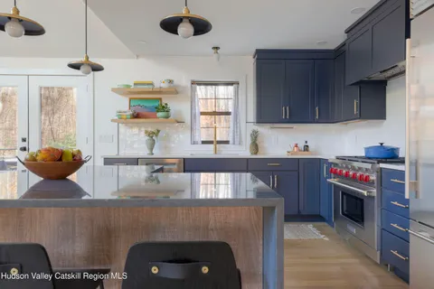 a view of livingroom with furniture and floor to ceiling window