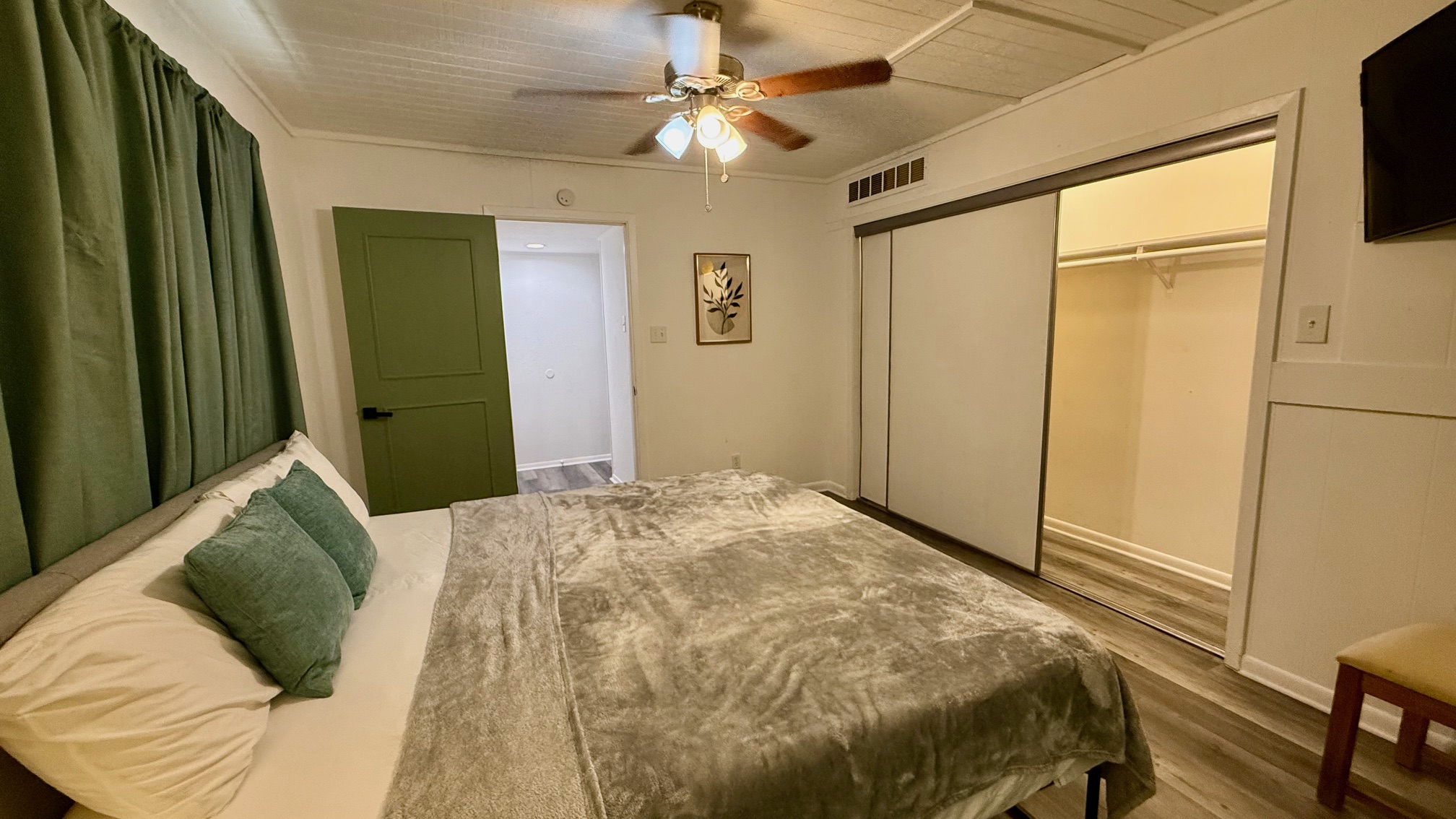 1802 East University Avenue, Unit A Georgetown, TX 78626 - Photo 10 of 23 Bedroom with wood finished floors and ceiling fan