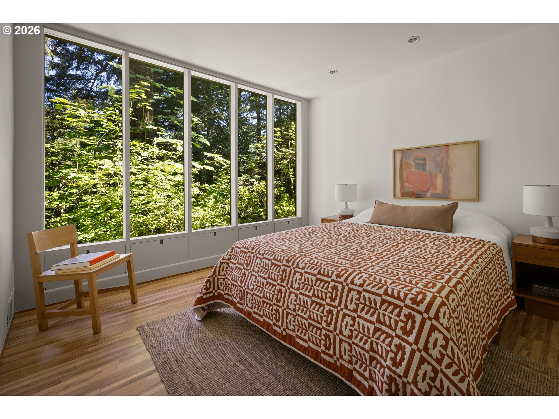4645 Southwest Fairview Boulevard Portland, OR 97221 - Photo 20 of 38 a bedroom with a bed window and wooden floor