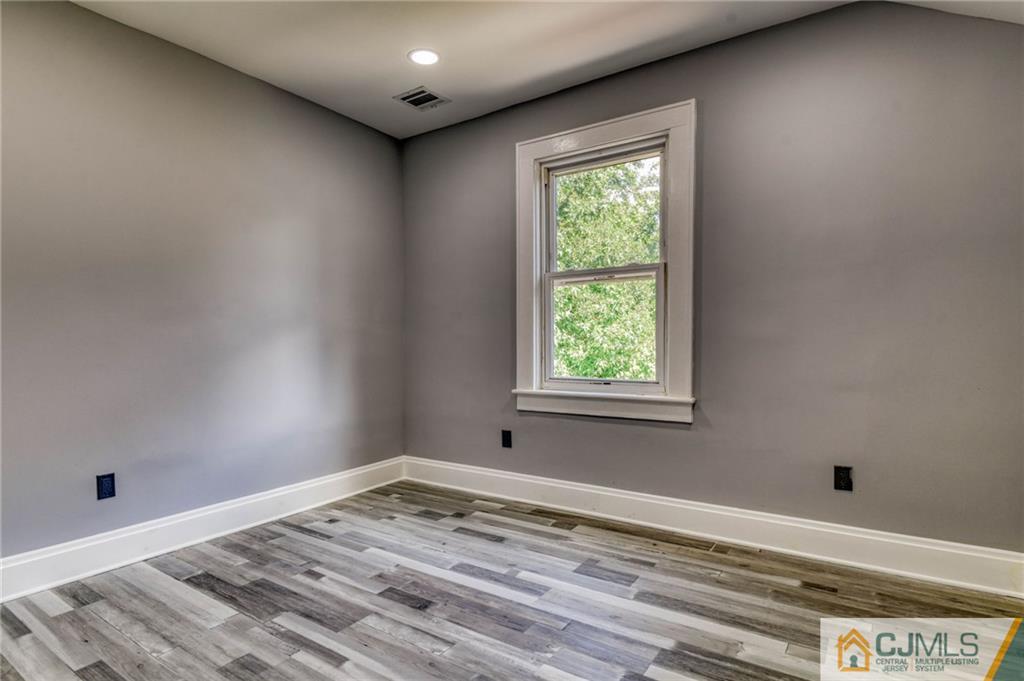 800 Old Raritan Road Edison, NJ 08820 - Photo 23 of 31 a view of a room with window and hardwood floor