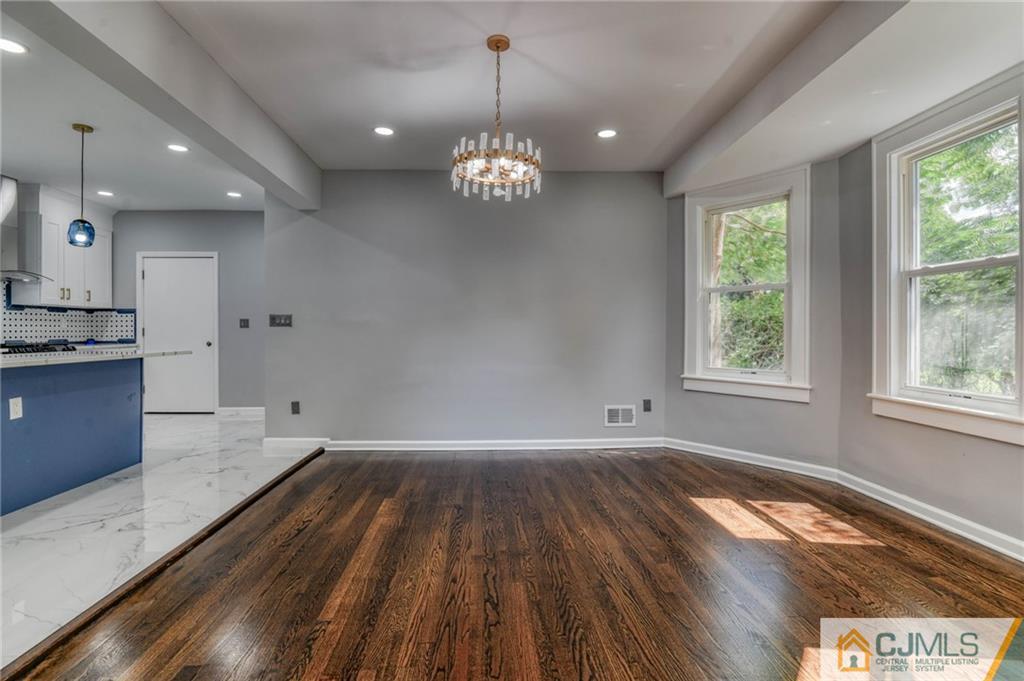 800 Old Raritan Road Edison, NJ 08820 - Photo 9 of 31 a view of an empty room with wooden floor and a window