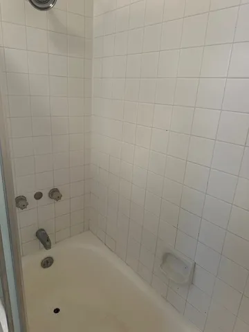 an empty room with closet and wooden floor