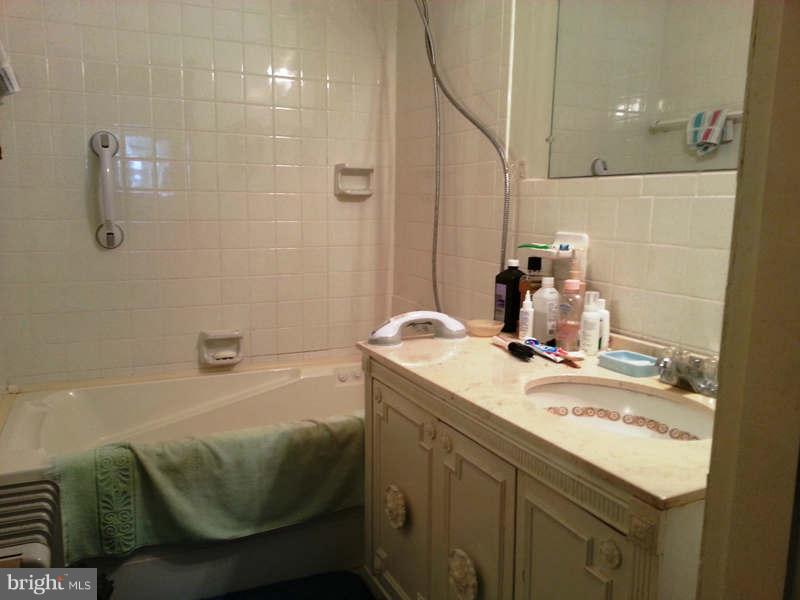 3355 Apple Pie Ridge Road Winchester, VA 22603 - Photo 11 of 29 a bathroom with a granite countertop sink and a mirror