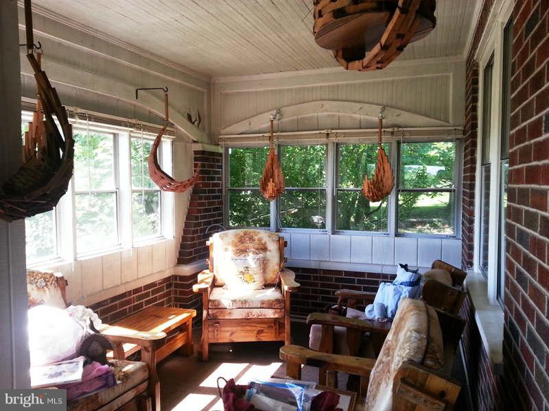 3355 Apple Pie Ridge Road Winchester, VA 22603 - Photo 13 of 29 a living room with furniture and a floor to ceiling window