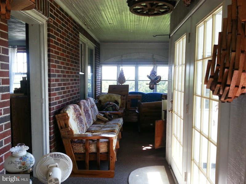 3355 Apple Pie Ridge Road Winchester, VA 22603 - Photo 15 of 29 a living room with furniture and a floor to ceiling window
