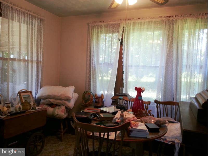 3355 Apple Pie Ridge Road Winchester, VA 22603 - Photo 17 of 29 a living room with furniture and floor to ceiling window