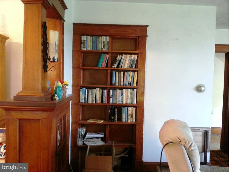 3355 Apple Pie Ridge Road Winchester, VA 22603 - Photo 19 of 29 a living room with furniture and a book shelf