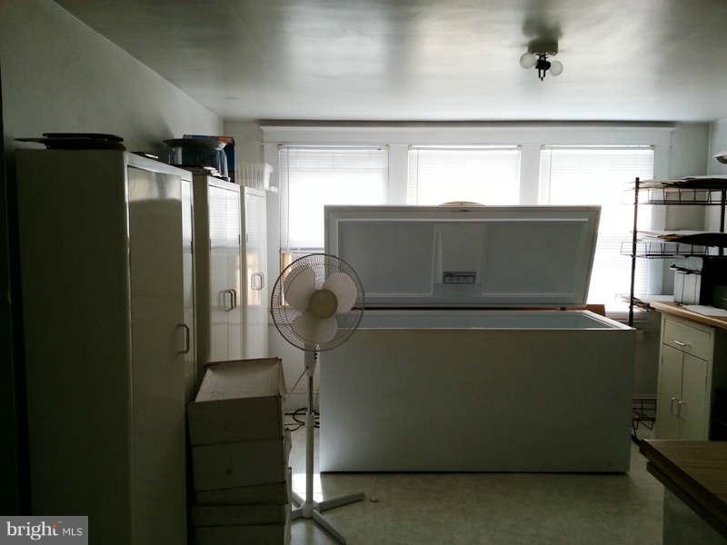3355 Apple Pie Ridge Road Winchester, VA 22603 - Photo 9 of 29 a close view of washer and dryer with wooden cabinet